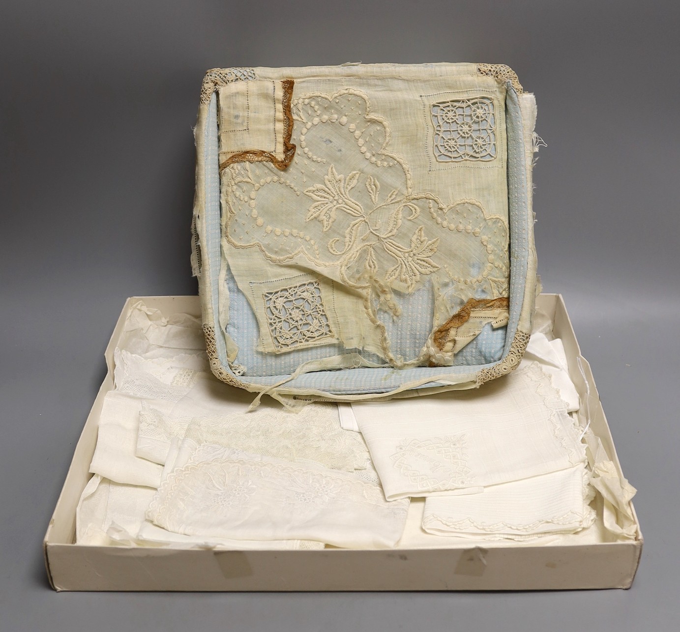 A lace box containing three 19th century Brussels bobbin lace and needle lace hankies and two fine tape lace hankies and a needle run hankie